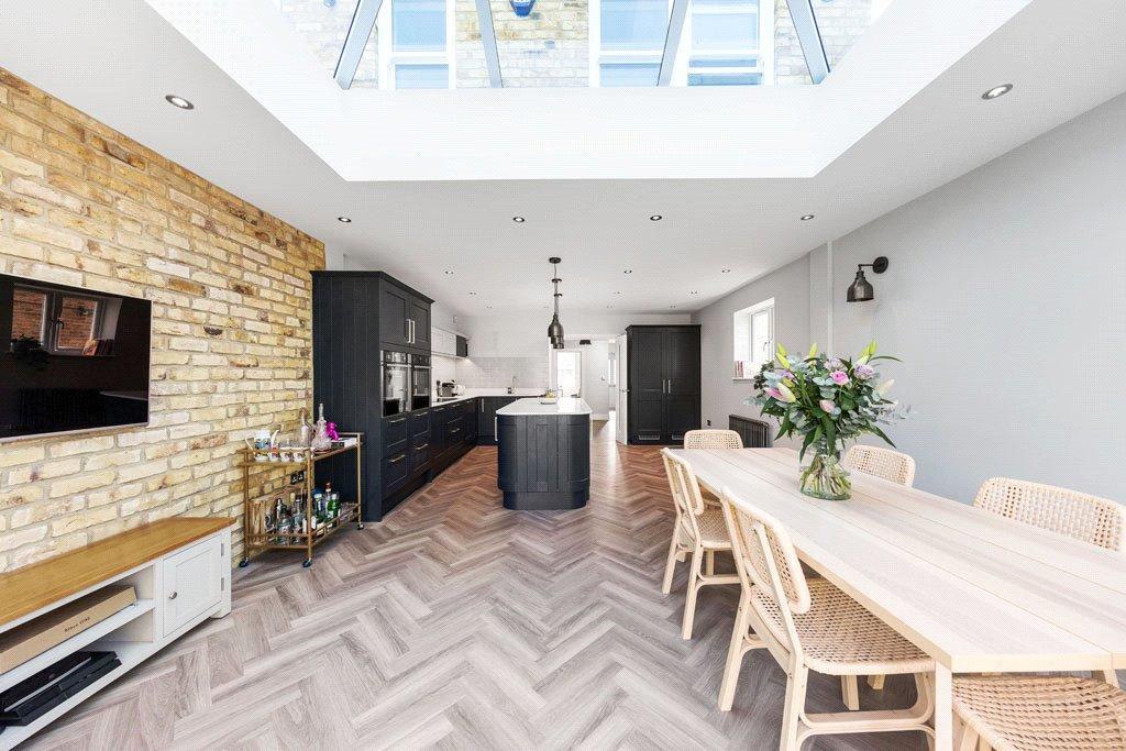 An open plan kitchen diner with skylight
